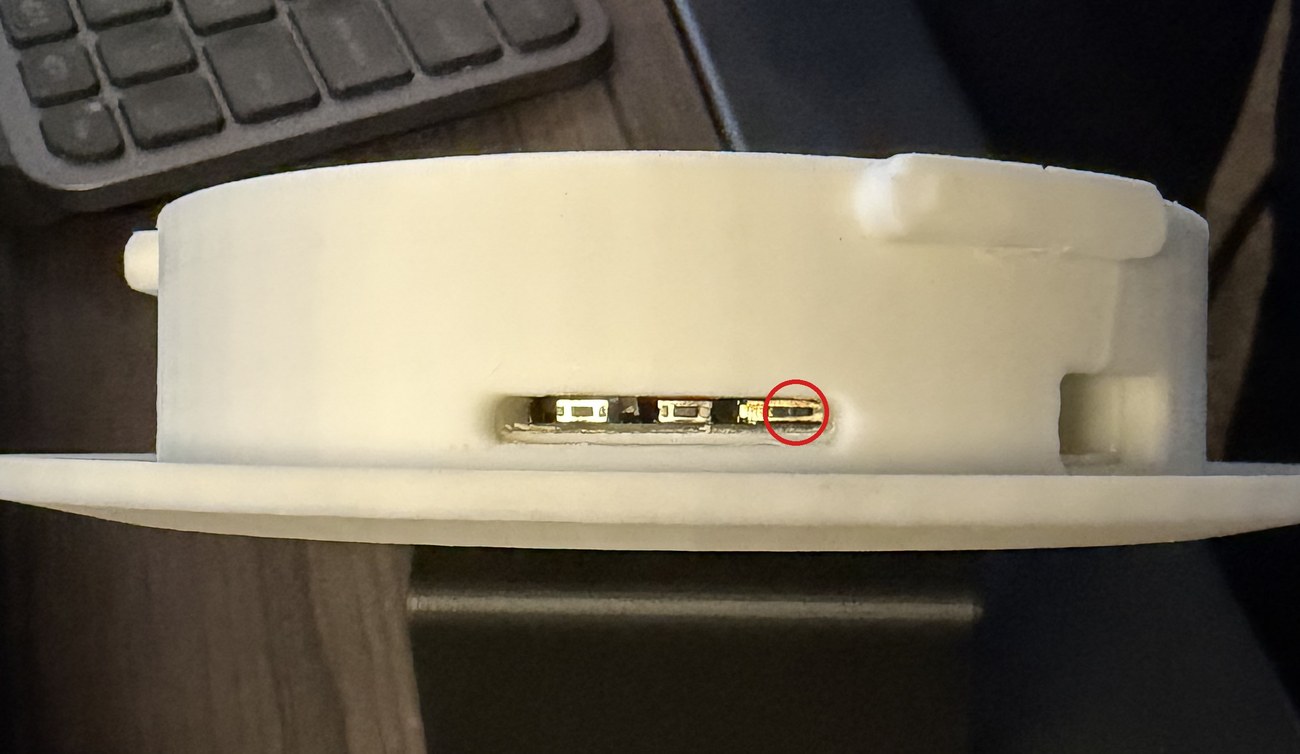 Close-up of the bottom edge with the power switch circled